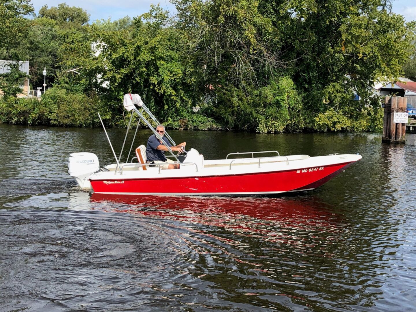 A person driving a motor boat